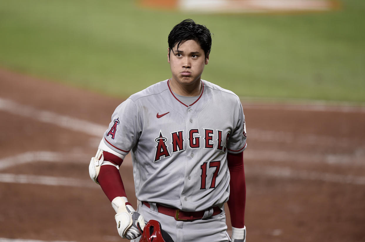 BALTIMORE, MARYLAND - AUGUST 25: Shohei Ohtani #17 of the Los Angeles Angels walks to the dugout after striking out in the sixth inning against the Baltimore Orioles at Oriole Park at Camden Yards on August 25, 2021 in Baltimore, Maryland. (Photo by G Fiume/Getty Images)