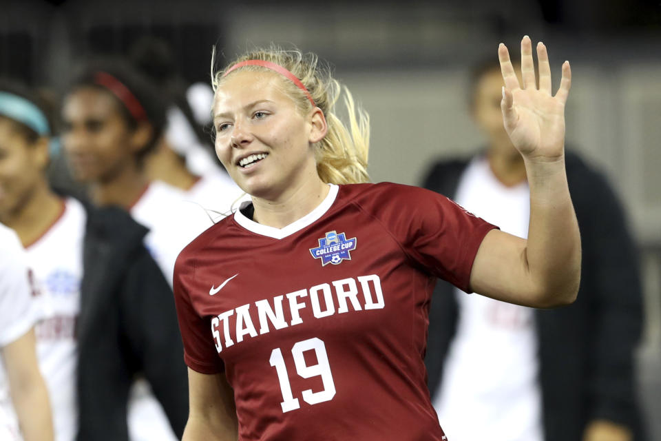 FILE - Stanford goalkeeper Katie Meyer (19) acknowledges the crowd after the team's 4-1 win over UCLA in a semifinal of the NCAA Division I women's soccer tournament in San Jose, Calif., on Dec. 6, 2019. (Ray Chavez/Bay Area News Group via AP, File)