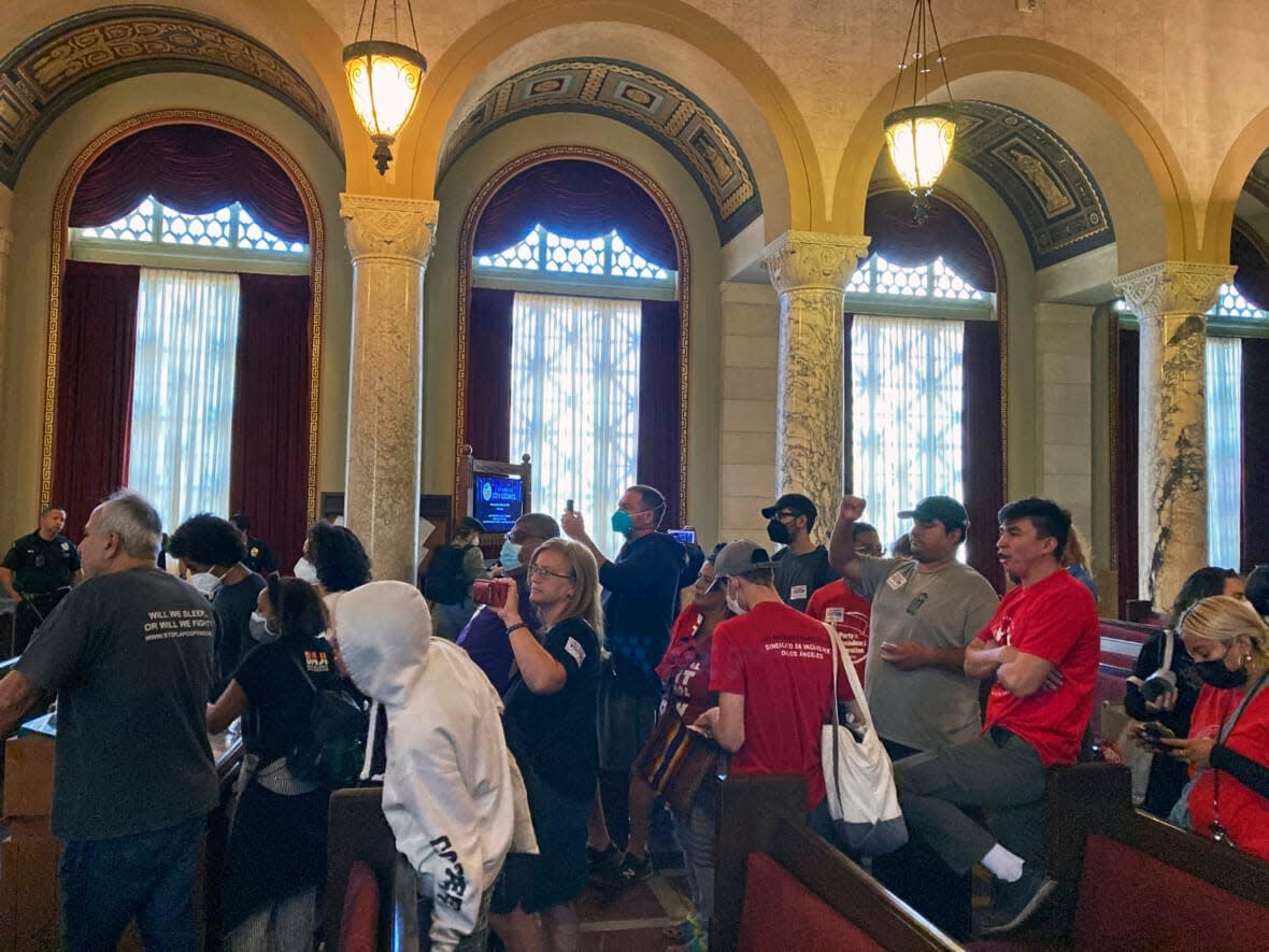 Protestors walk away after disrupting a Los Angeles City Council meeting demanding the resignations of council members, Kevin de Leon and Gil Cedillo in Los Angeles, Wednesday, Oct. 26, 2022. (AP Photo/Chris Weber)