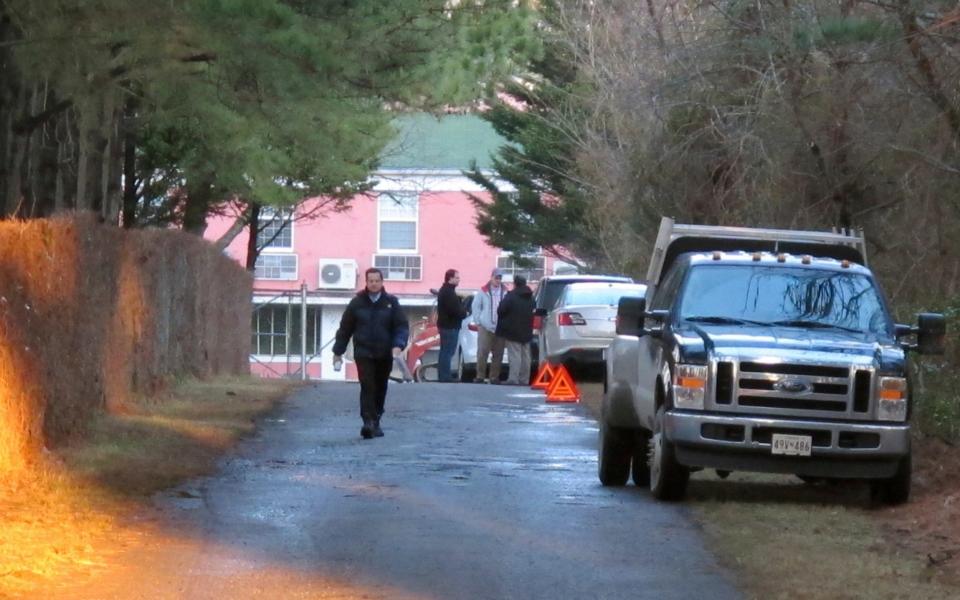 State department personnel outside the Maryland compound in December  - Credit: Brian Witte/AP