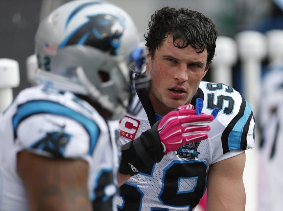 Carolina Panthers middle linebacker Luke Kuechly (59), former St. Xavier High school star, talks with a teammate on the sidelines during the fourth quarter of their game played at Paul Brown Stadium in Cincinnati, Ohio Sunday October 12, 2014. Bengals Panther 10122014 37