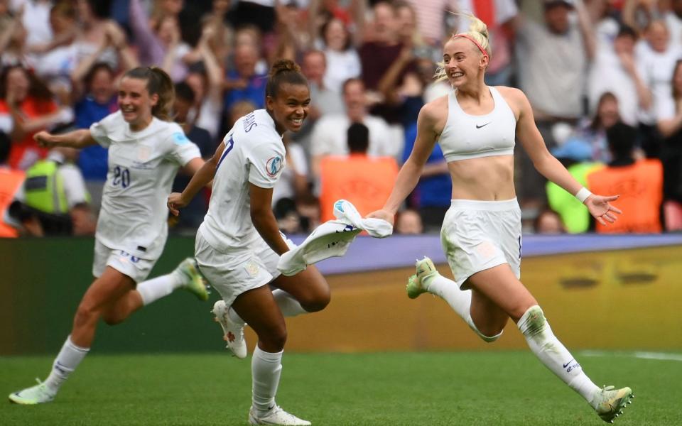 England's striker Chloe Kelly celebrates after scoring her team second goal - AFP