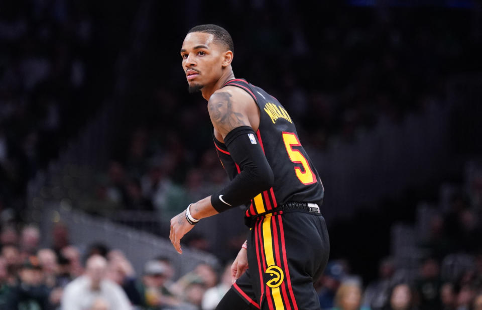 Atlanta Hawks guard Dejounte Murray looks back to the Boston Celtics bench after shooting a 3-point basket.