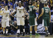 Wichita State forward Cleanthony Early (11) celebrates against Cal Poly during the first half of a second-round game in the NCAA college basketball tournament Friday, March 21, 2014, in St. Louis. (AP Photo/Jeff Roberson)