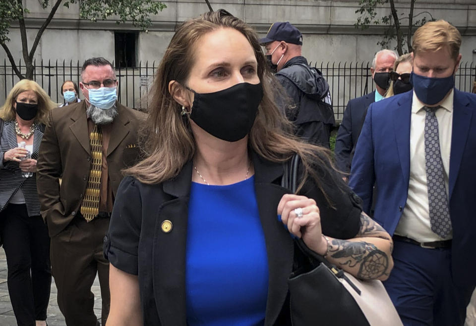Natalie Mayflower Sours Edwards, center, leaves court after receiving a six-month prison sentence for leaking confidential financial reports to a journalist at Buzzfeed, Thursday June 3, 2021, in New York. (AP Photo/Larry Neumeister)