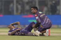 Kolkata Knight Riders' Sunil Narine gets traded for a muscle cramp during a break at the Indian Premier League cricket match between Kolkata Knight Riders and Rajasthan Royals in Kolkata, India, Tuesday, April 16, 2024. (AP Photo/Bikas Das)