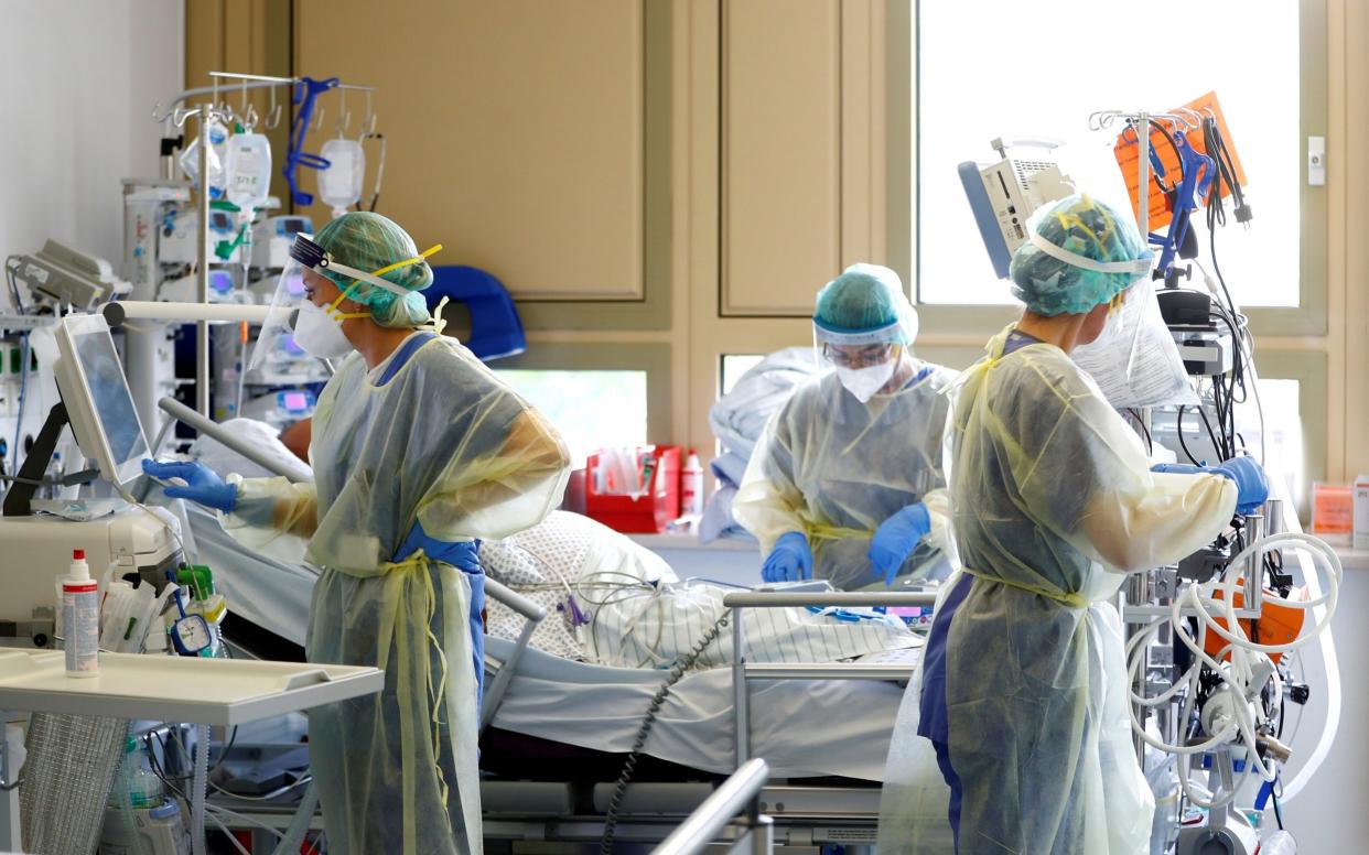 A patient suffering from COVID-19 receives treatment at the coronavirus disease (COVID-19) Intensive Care Unit (ICU) of the "Klinikum Darmstadt" clinic in Darmstadt, Germany, May 20, 2021