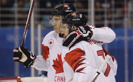 Ice Hockey – Pyeongchang 2018 Winter Olympics – Men Preliminary Round Match - Switzerland v Canada - Kwandong Hockey Centre, Gangneung, South Korea – February 15, 2018 - Rene Bourque (L) and Gilbert Brule of Canada on the ice during a game against Switzerland. REUTERS/David W Cerny