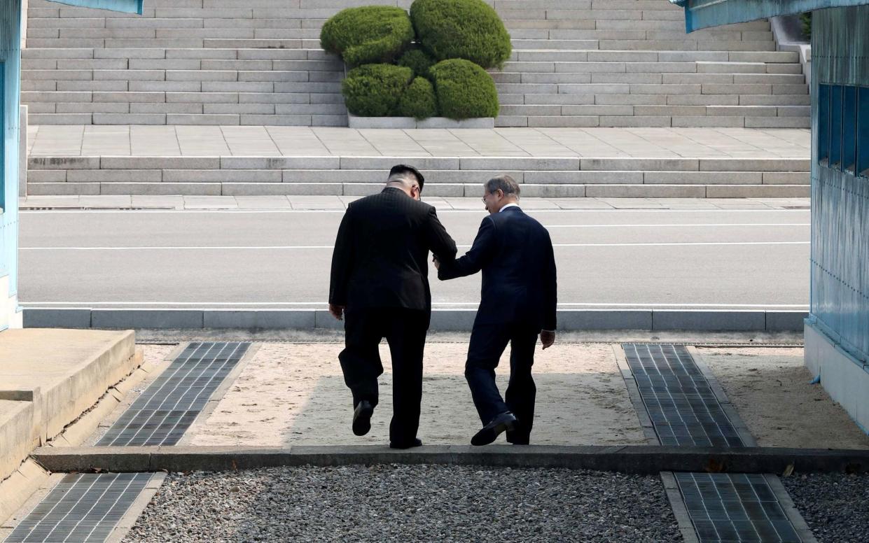 In an unplanned gesture that is likely to have increased theblood pressure of Mr Moon's security detail, Kim led his counterpart across the border into North Korea - REUTERS