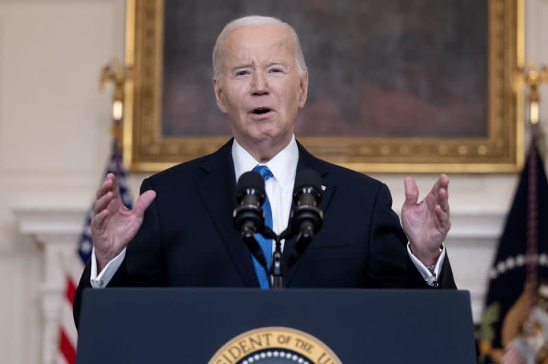 President Joe Biden gave remarks in the State Dining Room of the White House on Tuesday. He urged House Speaker Mike Johnson to allow the bipartisan defense-aid bill to be voted on in the House, where he says it will pass. Photo by Michael Reynolds/UPI