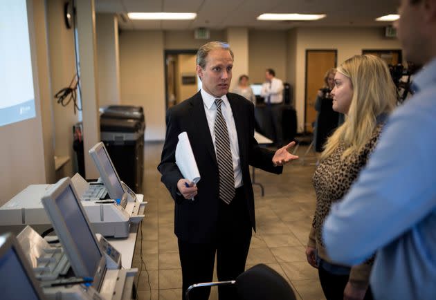 Minnesota Secretary of State Steve Simon (L) speaks with city clerk Melissa Kennedy (C) and election specialist Robert Stokka (R) during a public accuracy test of Election Day voting machines at the Municipal Services Center on Oct. 23, 2018 in St. Louis Park, outside Minneapolis, Minnesota. (Photo: Stephen Maturen via Getty Images)