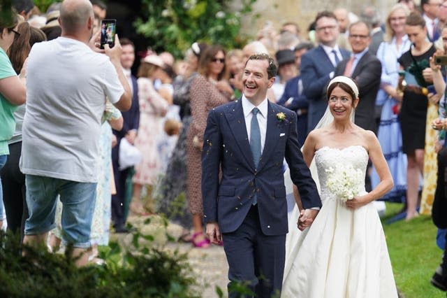 There were claps and cheers as the newly married couple left the church (Stefan Rousseau/PA)