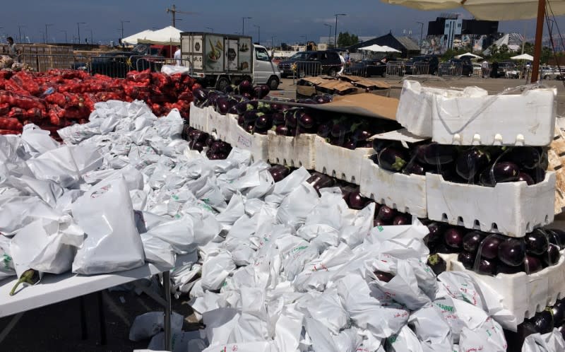 A view shows boxes of eggplants to be distributed for free to people in need, as an initiative from Lebanese businessman Fadi Khairo, in Beirut