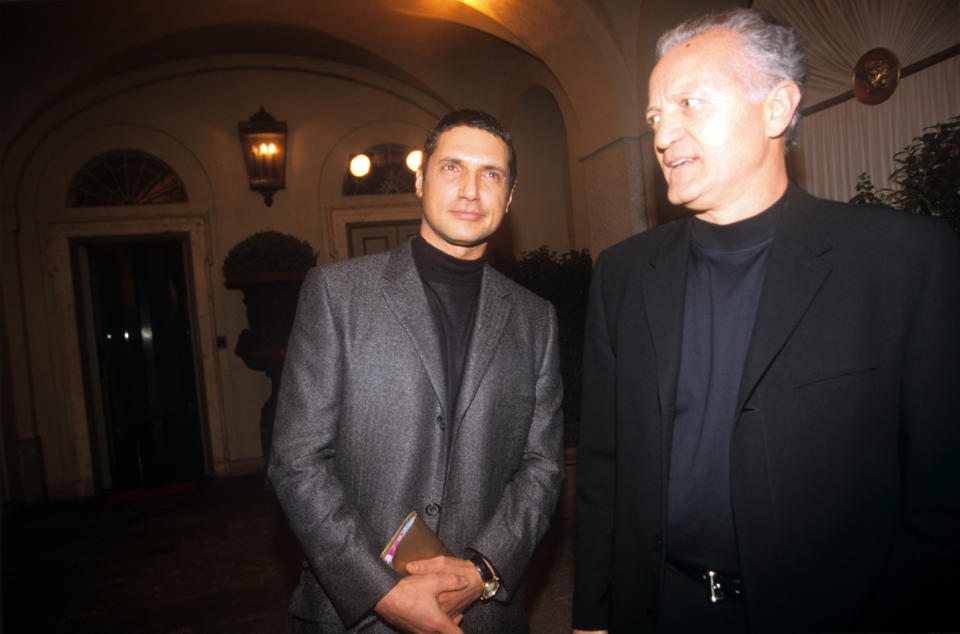 From the left, the fashion designer Antonio D'Amico and Santo Versace, respectively the former partner and the elder brother of the deceased Gianni Versace, are awaiting the beginning of the fashion show dedicated to the spring/summer collection at the via Gesù seat. Milan (Italy), 6th March 1998.