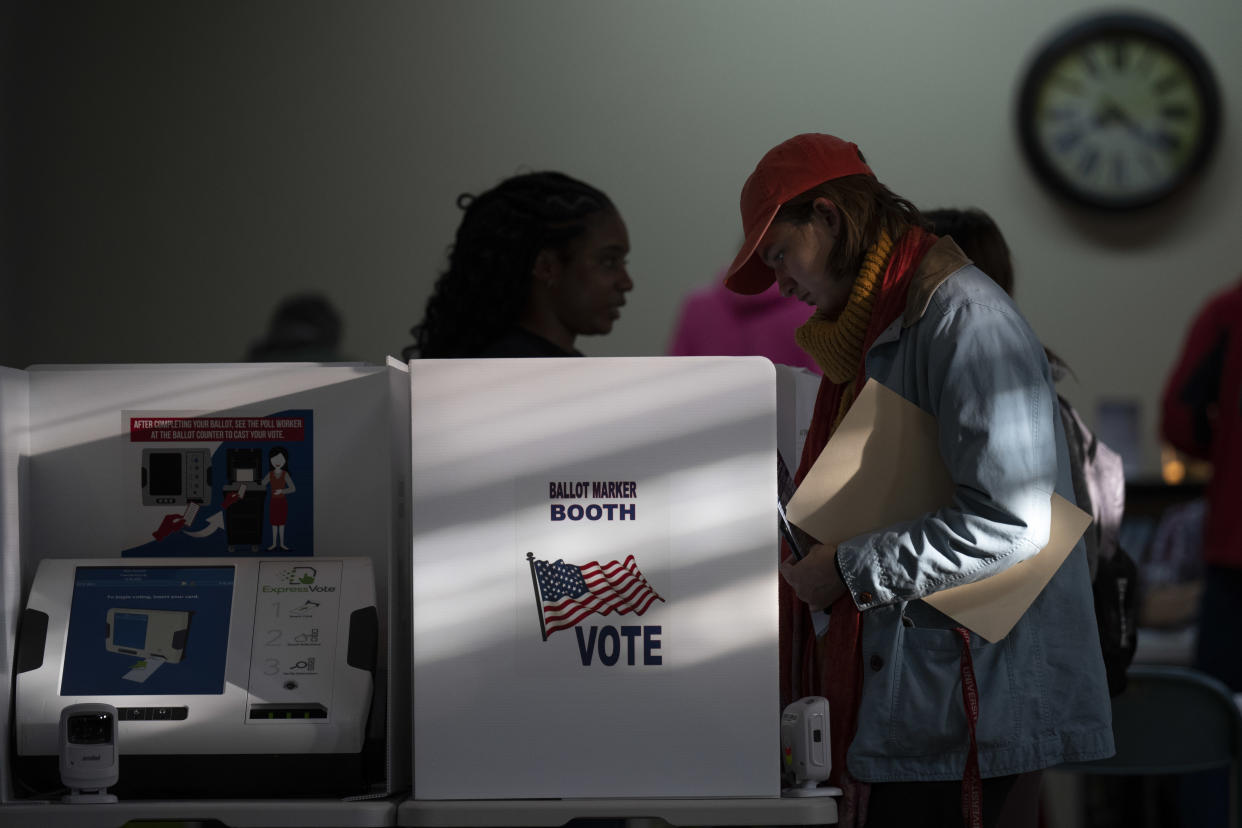 People vote at a polling location 