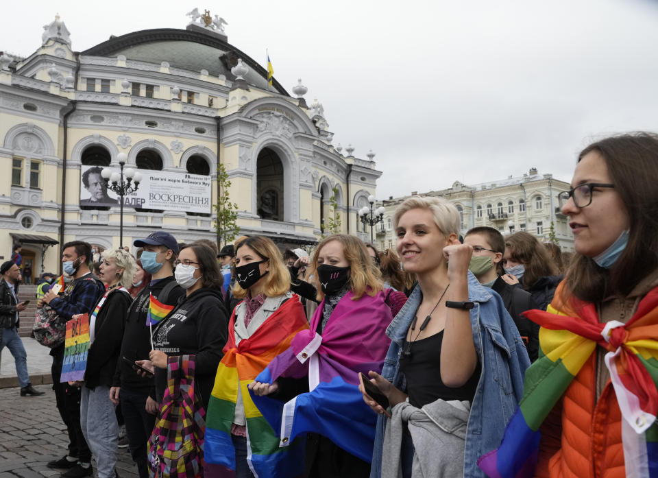 People take part in the annual Gay Pride parade, under the protection of riot police in Kyiv, Ukraine, Sunday, Sept. 19, 2021. Around five thousand LGBT activists and associations paraded in the center of Kyiv. (AP Photo/Efrem Lukatsky)