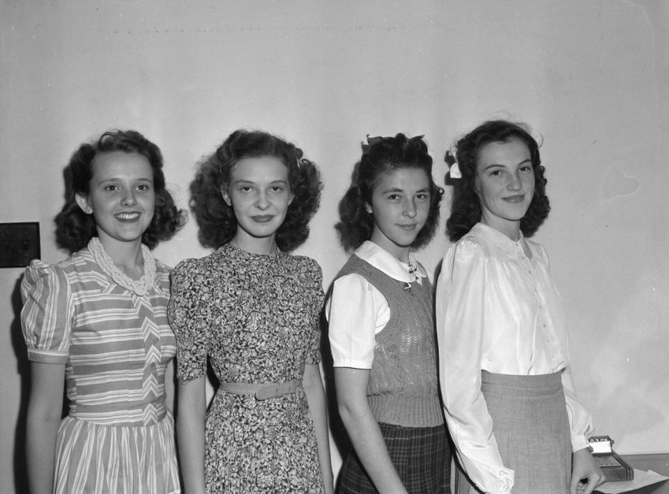 1941: Amon Carter Riverside High School Reserve Officers’ Training Corps (R. O. T. C.) sponsors, left to right, Irma Jean Bradford, Mary Alice Brady, Mary Helen Boustead and Reta McElhannon. They are standing in line and posing for a picture. 