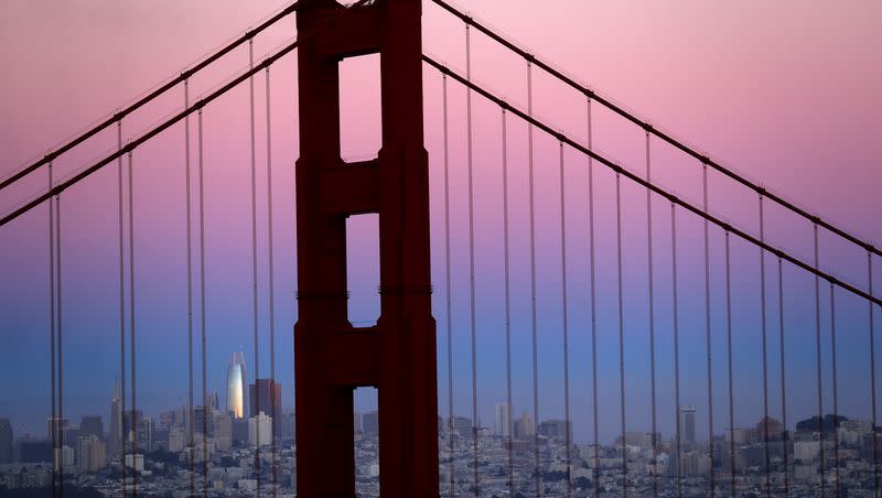 The Salesforce Tower and the San Francisco skyline behind the Golden Gate Bridge at dusk on Sunday, July 14, 2019.