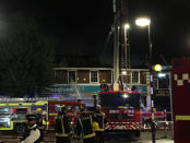 Firefighters battle a fire at a department store in Chingford, London, Britain August 23, 2017 in this still image obtained from social media. Jonathan Boyce via REUTERS