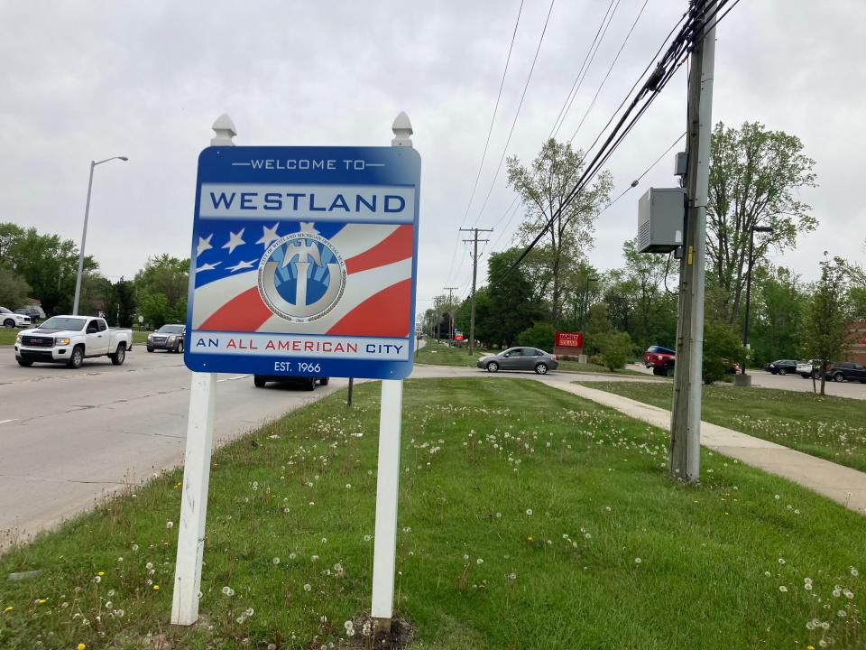 A sign welcomes visitors and residents to Westland with the city motto: "An All American City."