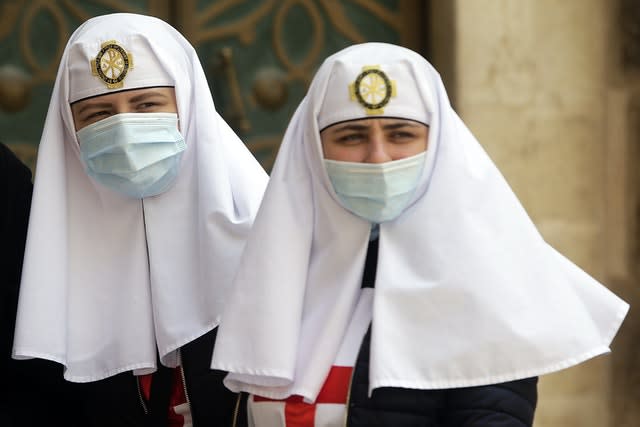 Two nuns wear protective face masks at the Church of the Holy Sepulchre(Mahmoud Illean/AP)
