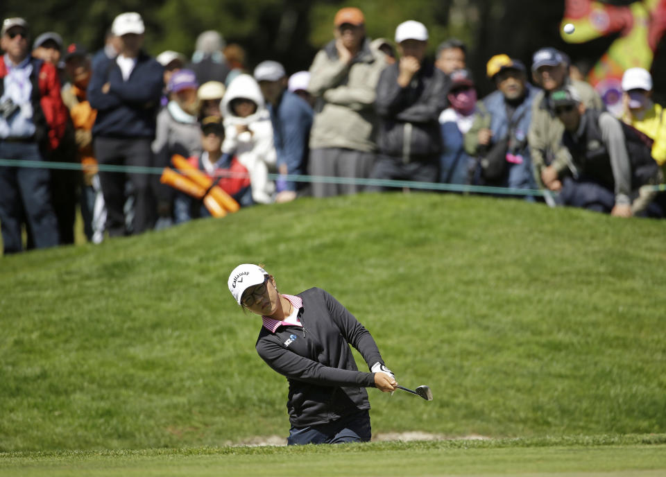 Lydia Ko, of New Zealand, hits out of a bunker onto the sixth green of Lake Merced Golf Club during the final round of the Swinging Skirts LPGA Classic golf tournament on Sunday, April 27, 2014, in Daly City, Calif. (AP Photo/Eric Risberg)