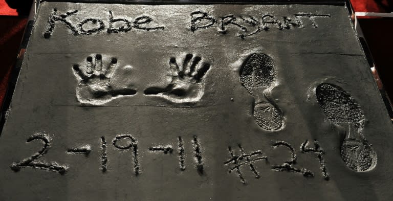 The handprints and footprints made by the late NBA star Kobe Bryant in 2011 at Grauman' Chinese Theater in Hollywood are among items set to be auctioned next month (AFP Photo/GABRIEL BOUYS)
