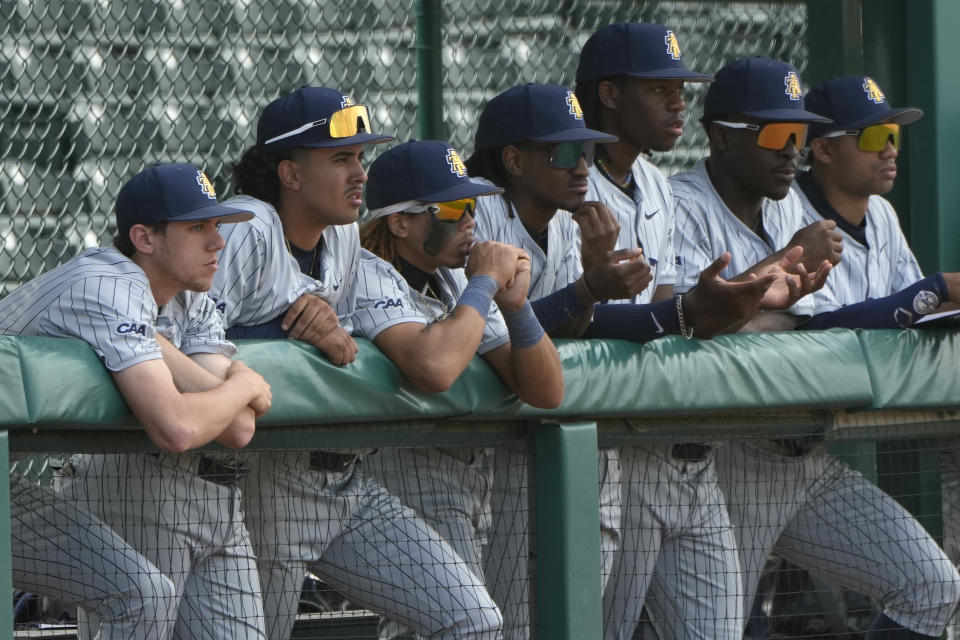 North Carolina A&T State University players watch from the dugout during a game against Prairie View A&M University at the Andre Dawson Classic tournament, Friday, Feb. 23, 2024, at the Jackie Robinson Training Complex, in Vero Beach, Fla. The percentage of Black major league players has been declining for decades and remains historically low, but there are signs of improvement in the league's player development pipeline. (AP Photo/Lynne Sladky)