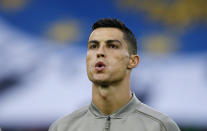 FILE - In this Oct. 6, 2018, file photo, Juventus forward Cristiano Ronaldo warms up prior to a soccer match against Udinese, in Udine, Italy. Ronaldo's new Las Vegas lawyer is calling documents cited in media reports about a woman's claim that he raped her in 2009 "complete fabrications," and says the encounter was consensual. (AP Photo/Antonio Calanni, file)