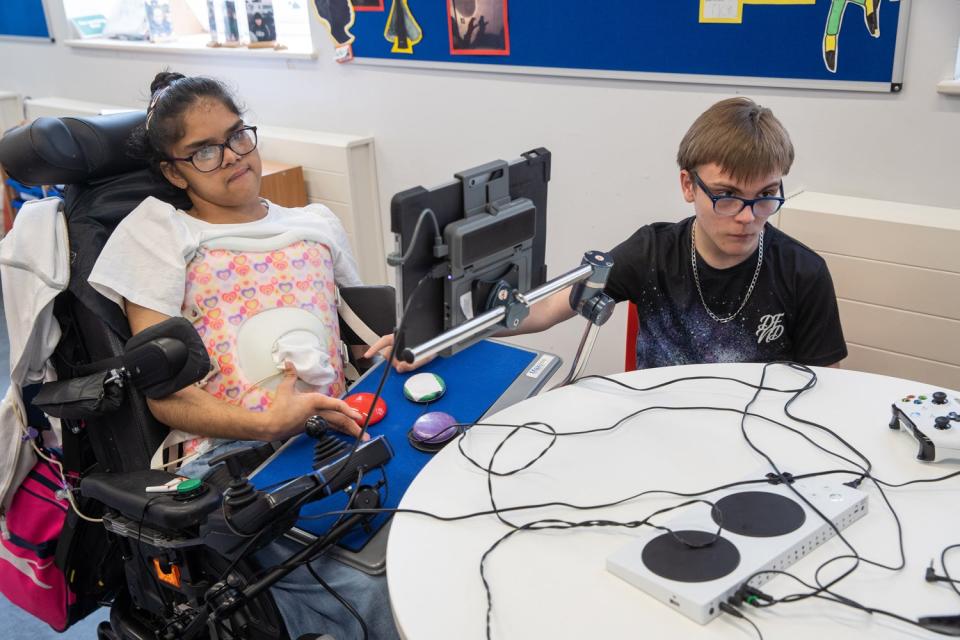 Safia and Jack team up and play the Xbox games during a classroom sessions (Jeff Moore)