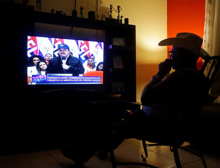 A man watches a TV broadcast of Nicaraguan President Daniel Ortega in Managua, Nicaragua February 21, 2019. REUTERS/Oswaldo Rivas