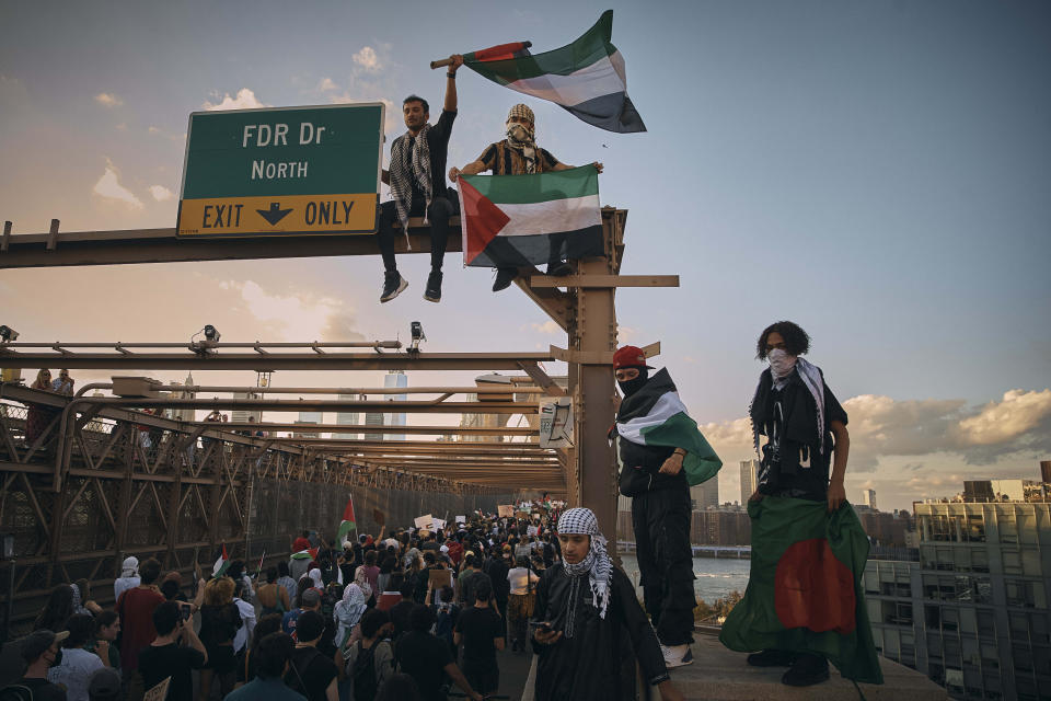 Protestors cross the Brooklyn Bridge in New York on Oct. 28, 2023, in a pro-Palestinian demonstration demanding a ceasefire between Israel and Hamas. (AP Photo/Andres Kudacki)