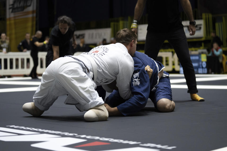 Ukrainian war veterans with amputated limbs perform at the Ukrainian national competition of jiu jitsu in Kyiv, Ukraine, Sunday, Oct. 29, 2023. More than 20,000 people in the Ukraine have lost limbs from injuries since the start of the Russian war, many of them soldiers. Some of them have learned to deal with their psychological trauma by practicing a form of Brazilian jiu-jitsu. (AP Photo/Roman Hrytsyna)