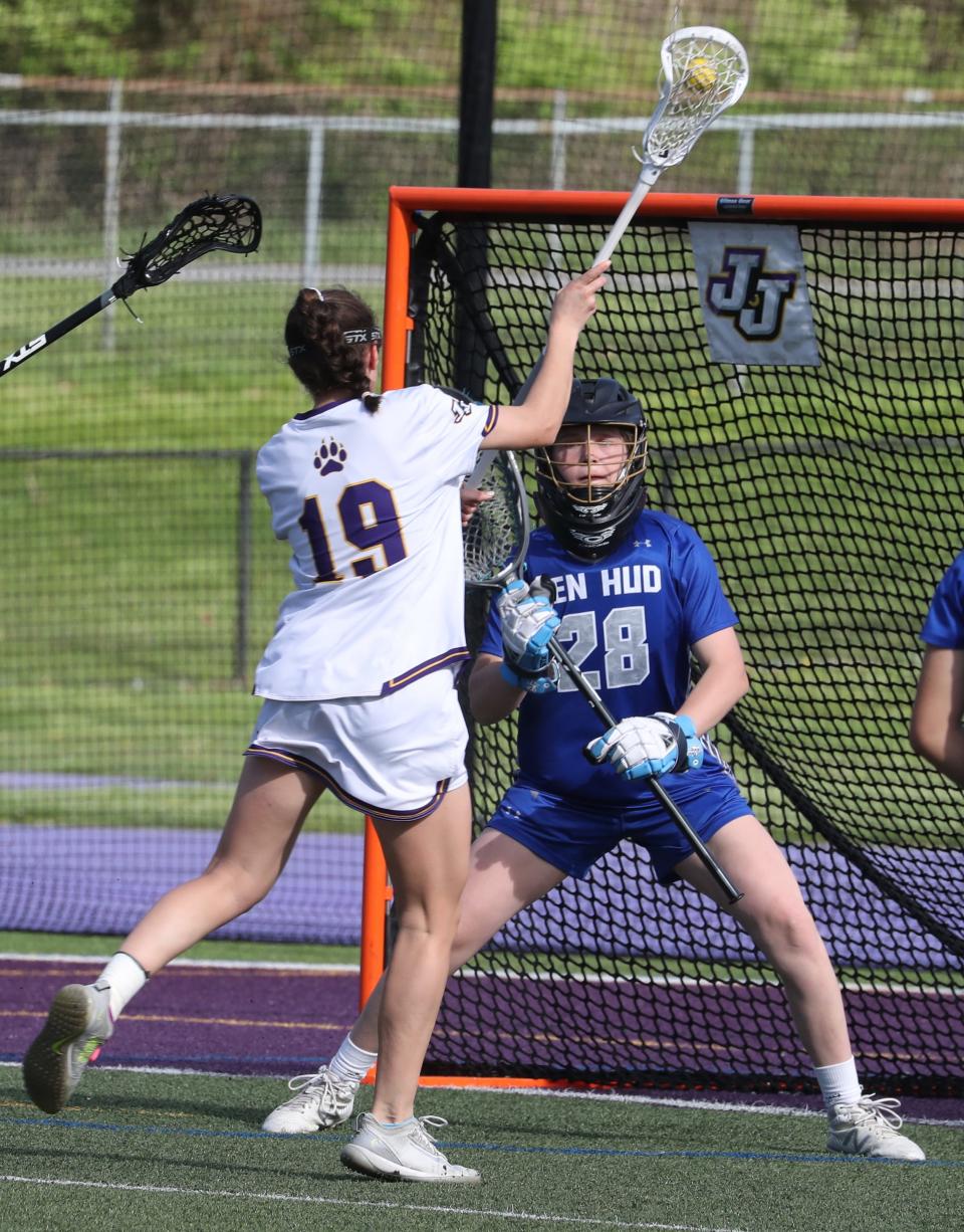 John Jay-Cross River's Mia Puccio shoots against Hen Hud goalie Madison Porter during a girls lacrosse game on May 10, 2022.