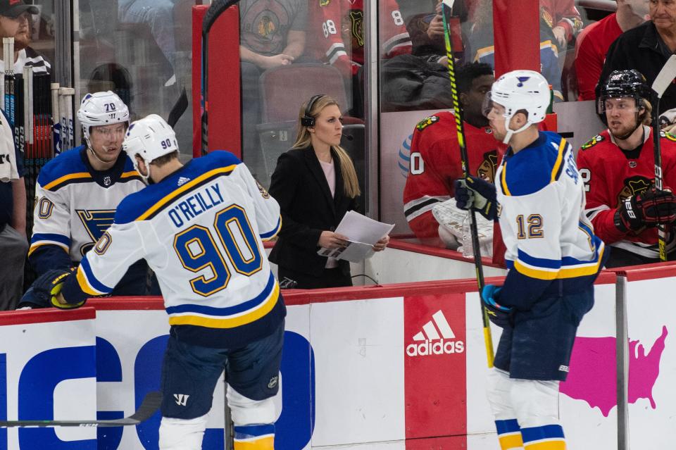 Coyne Schofield analyzing the game from the ice