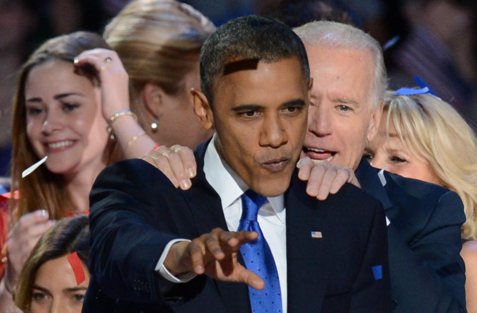 US President Barack Obama and Vice President Joe Biden celebrate winning the 2012 US presidential election November 7, 2012 in Chicago, Illinois.  Obama swept to re-election, forging history again by defying the dragging economic recovery and high unemployment which haunted his first term to beat Republican Mitt Romney.   AFP PHOTO / Saul LOEB        (Photo credit should read SAUL LOEB/AFP/Getty Images)