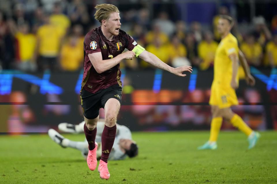 Belgium's Kevin De Bruyne celebrates after scoring his side's second goal during a Group E match between Belgium and Romania at the Euro 2024 soccer tournament in Cologne, Germany, Saturday, June 22, 2024. (AP Photo/Martin Meissner)