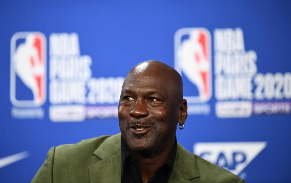 Michael Jordan speaks at a press conference.