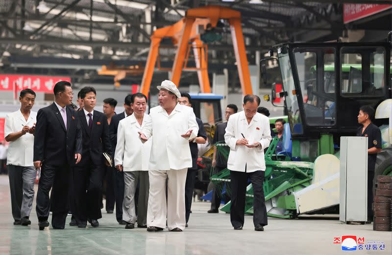 North Korean leader Kim Jong Un inspects the Kumsong Tractor Factory