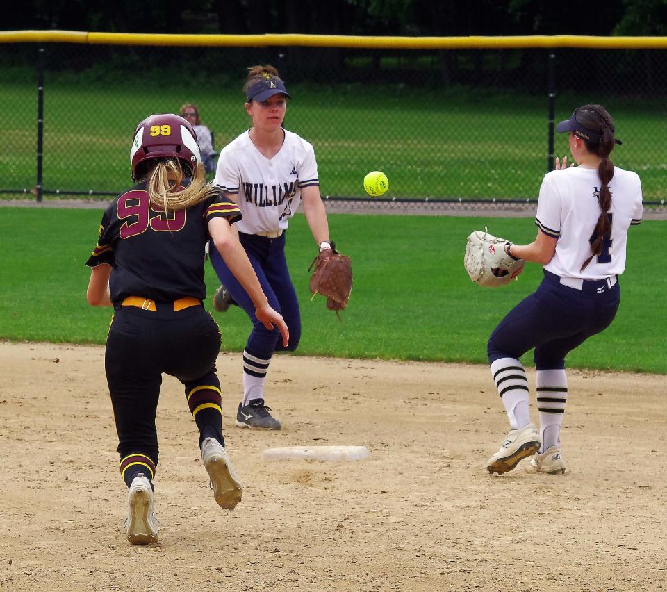 Archie's played solid defense in the semis vs Case of Swansea. Archbishop Williams shortstop Emma Chenette tosses the ball - out of her glove - to second baseman Emma O'Neill for the force out of Case baserunner Jamie Moniz on Wednesday, June 14, 2023.