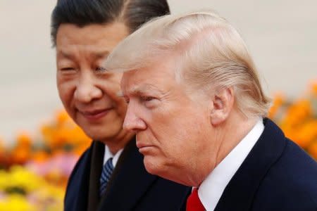 U.S. President Donald Trump takes part in a welcoming ceremony with China's President Xi Jinping in Beijing, China, November 9, 2017. REUTERS/Damir Sagolj/File Photo