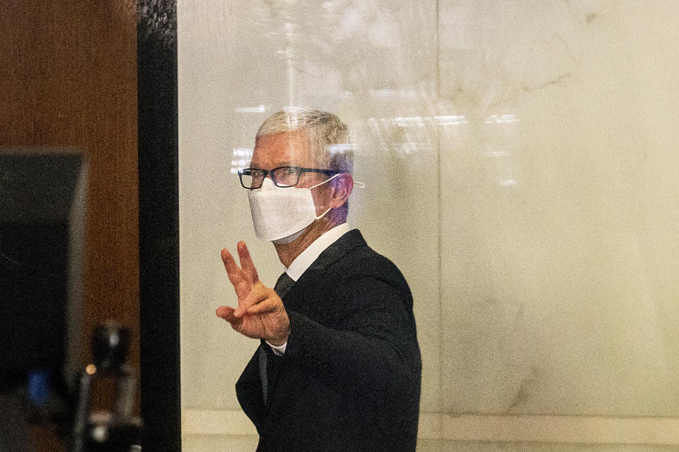 Apple CEO Tim Cook leaves the Ronald V. Dellums building in Oakland, Calif., after testifying in a federal court case brought by Epic Games on Friday, May 21, 2021. Epic, maker of the video game Fortnite, charges that Apple has transformed its App Store into an illegal monopoly. (AP Photo/Noah Berger)