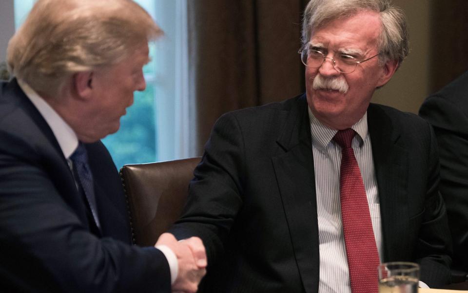 John Bolton with Donal Trump in 2018 - NICHOLAS KAMM/AFP