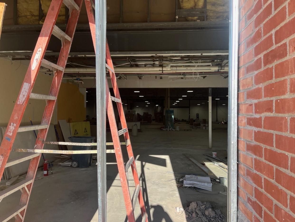 A peek inside the new Tesla store being fitted up at the former Hannaford supermarket off Shelburne Road in South Burlington, as seen on Dec. 19, 2023.