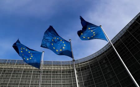 European Union flags flutter outside the EU Commission headquarters in Brussels, Belgium, March 12, 2018. REUTERS/Yves Herman/Files