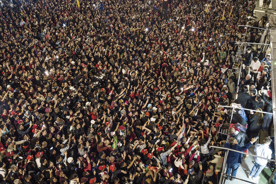 Former Brazilian President Luiz Inacio Lula da Silva, right, who is running for president again, speaks to supporters after general election polls closed in Sao Paulo, Brazil, Sunday, Oct. 2, 2022.(AP Photo/Matias Delacroix)