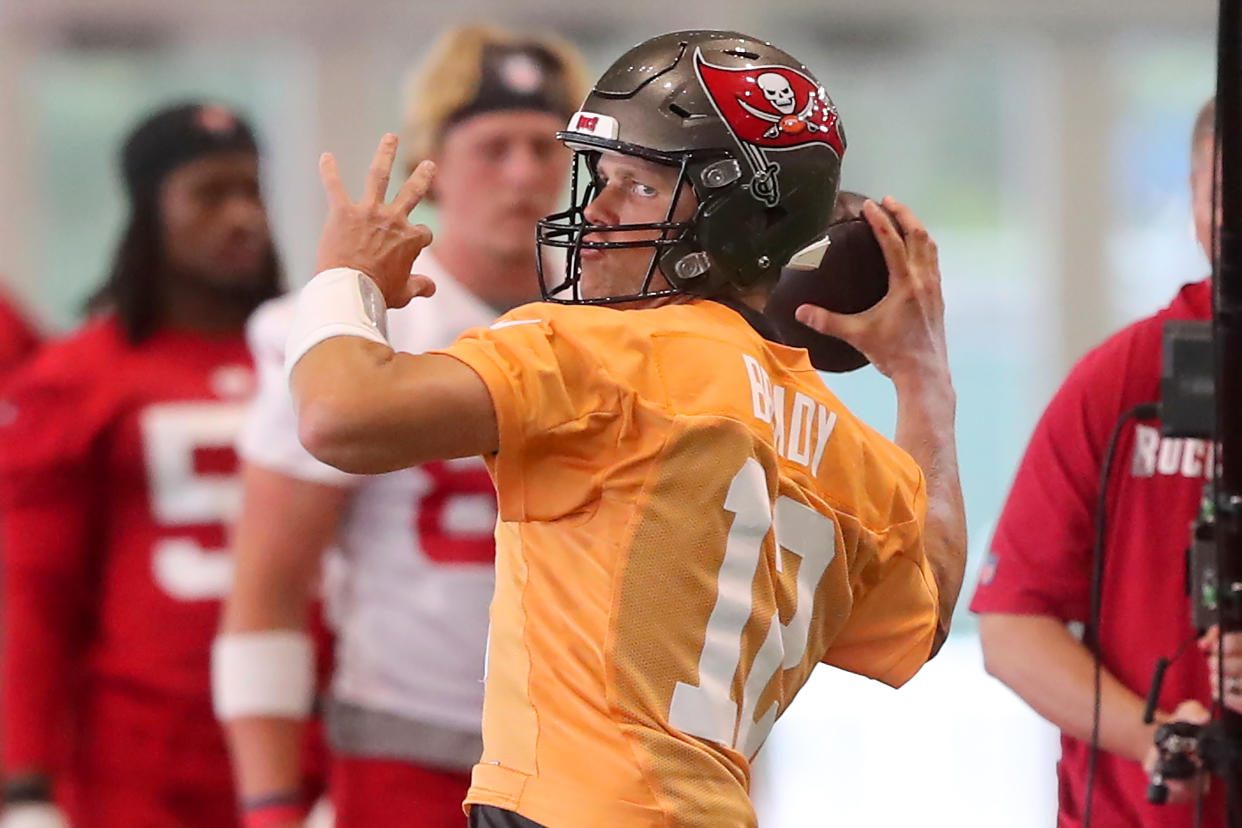 TAMPA, FL - JUN 09: Tampa Bay Buccaneers quarterback Tom Brady (12) goes thru a drill during the Tampa Bay Buccaneers Minicamp on June 09, 2022 at the AdventHealth Training Center at One Buccaneer Place in Tampa, Florida. (Photo by Cliff Welch/Icon Sportswire via Getty Images)