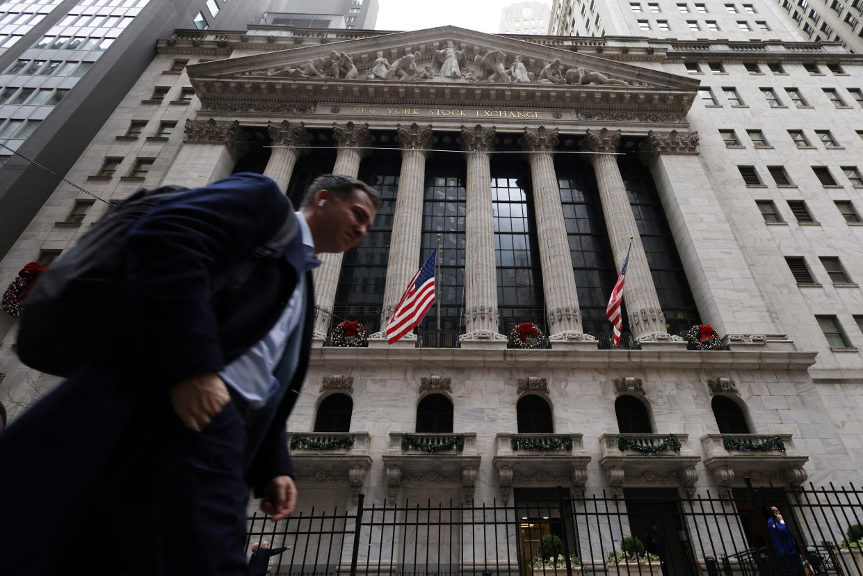 A person walks by the New York Stock Exchange (NYSE) in New York City, U.S., January 5, 2023. REUTERS/Andrew Kelly