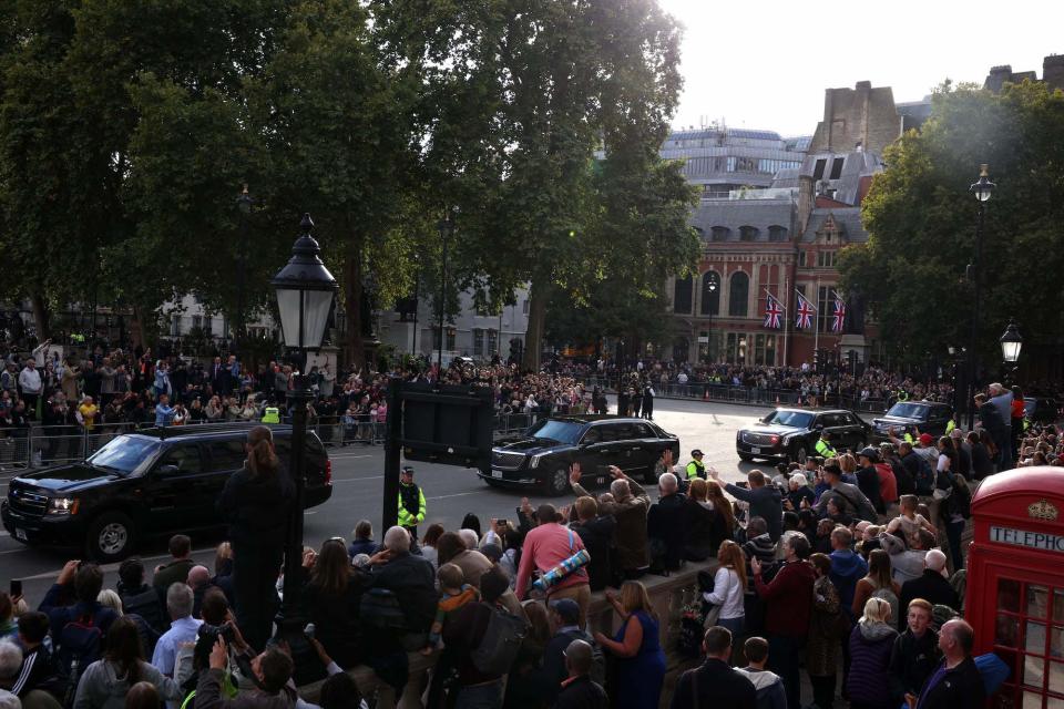 Mourners gather to watch Queen Elizabeth II's funeral procession on September 19, 2022.