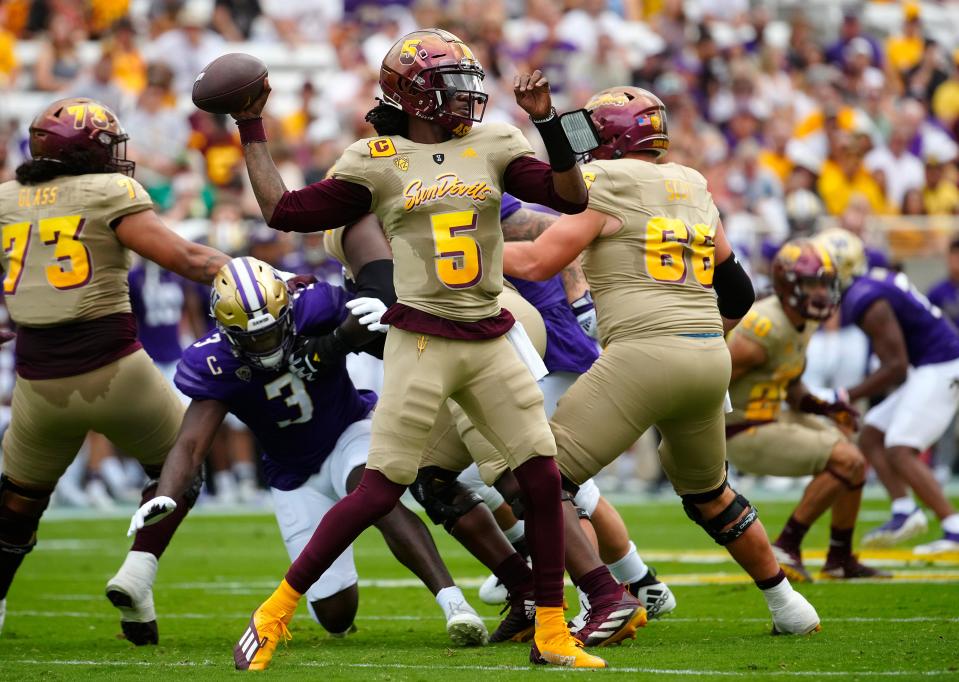 ASU quarterback Emory Jones (5) throws a pass against Washington during a game at Sun Devil Stadium. Jones transferred to UC in December.